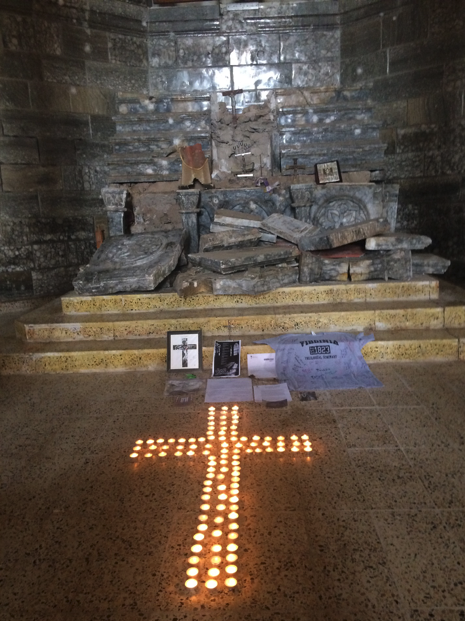 Broken Altar with lit-candle Cross